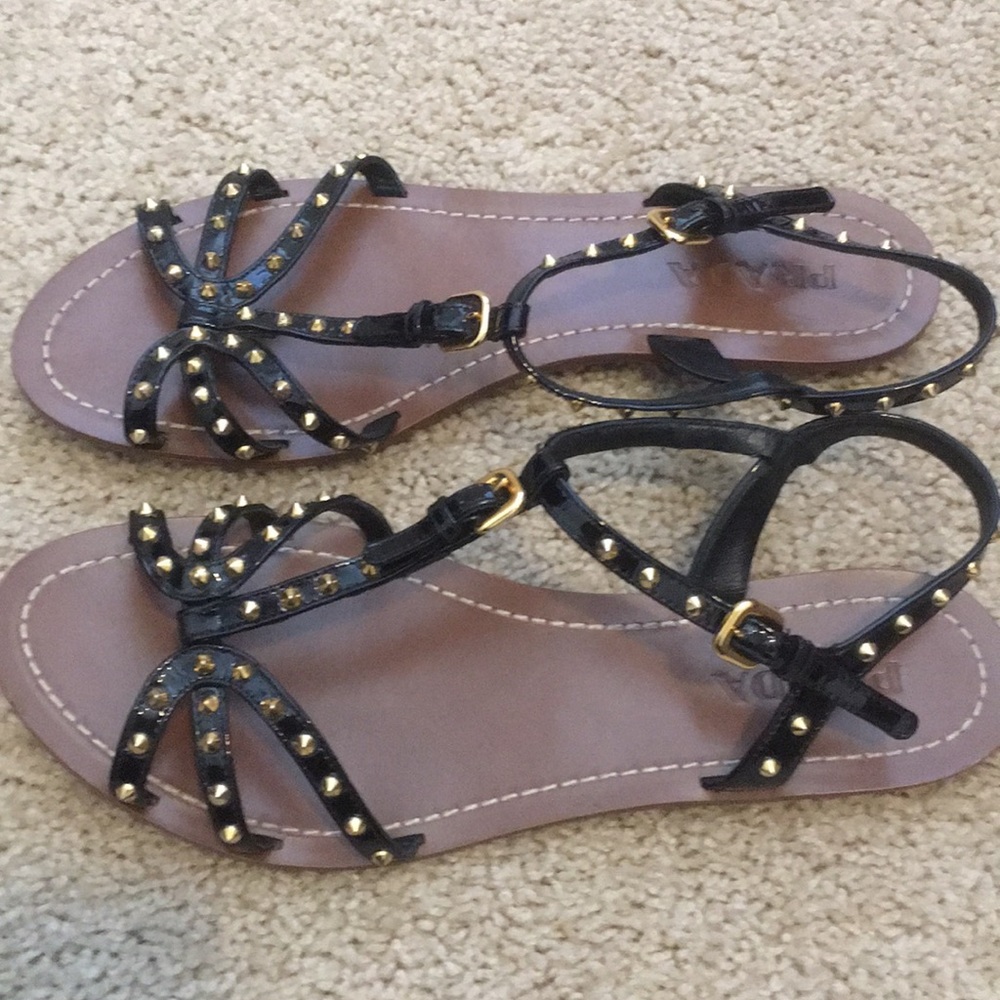 Prada black flat sandal with gold accents
